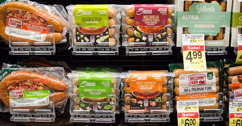 brats on display in a grocery store refrigerator