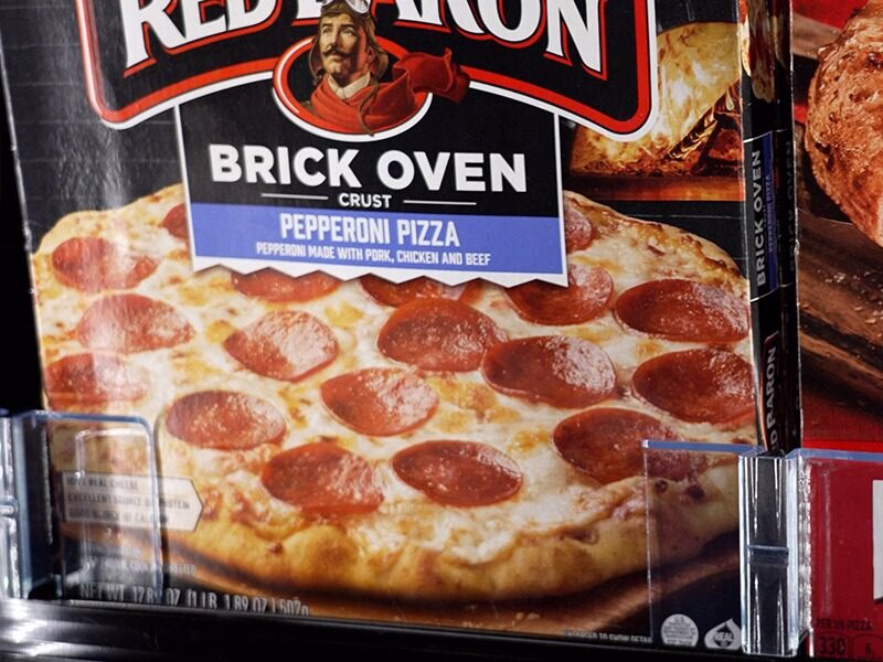 Frozen pizza in ShelfHero On-Shelf Freezer Merchandising Solution
