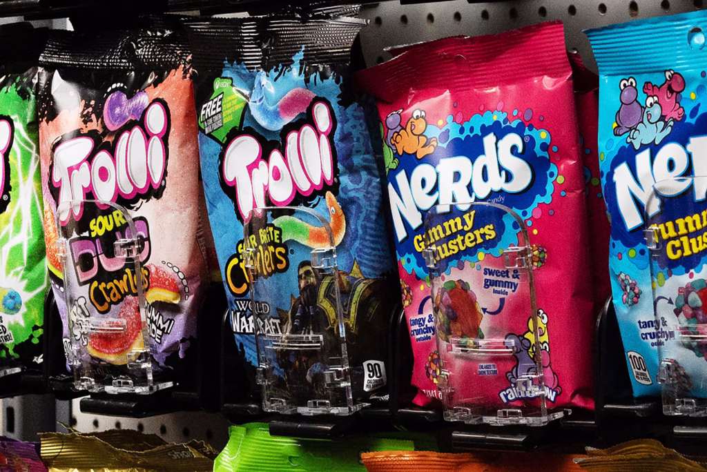 bags of candy hanging from pegs