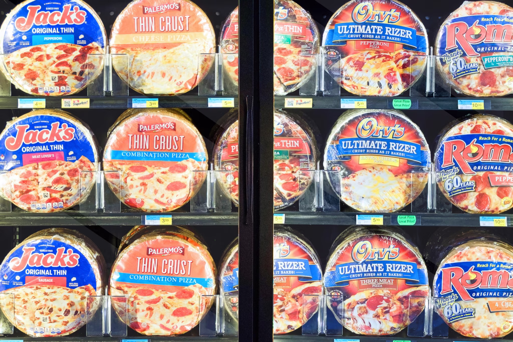 frozen pizzas in retail freezer