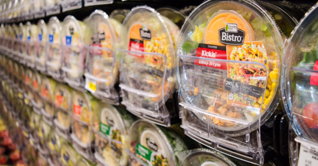 salads in pusher trays at a grocery store