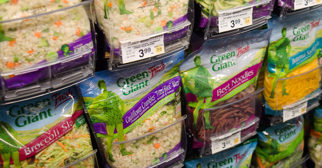 bagged salad in pusher trays